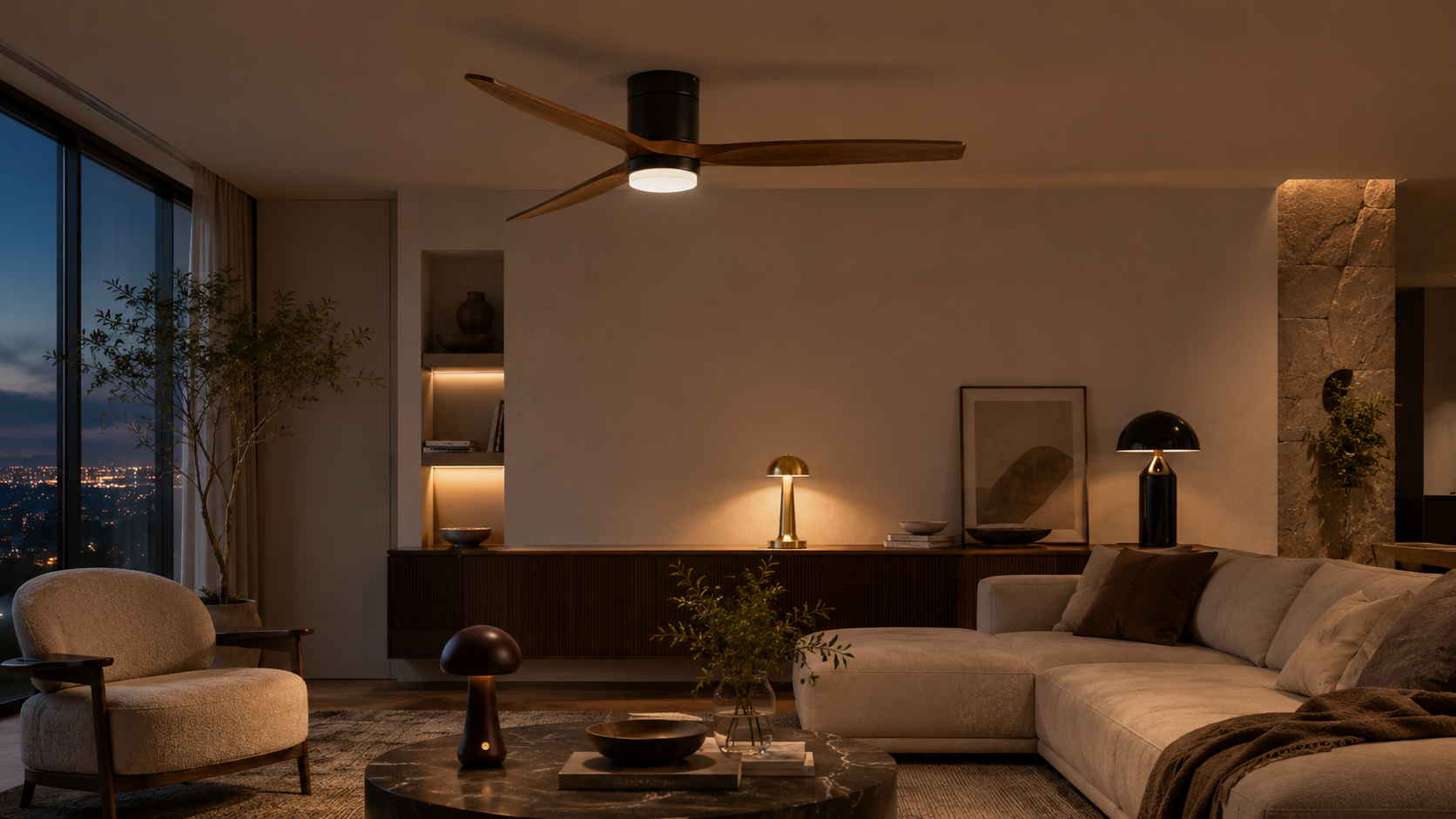 Modern living room with a ceiling fan, sofa, and decorative items.